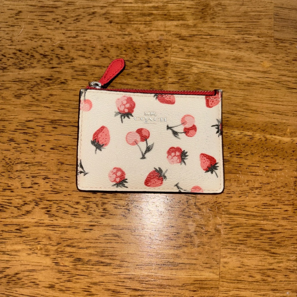 Coach red and cream berry card holder.